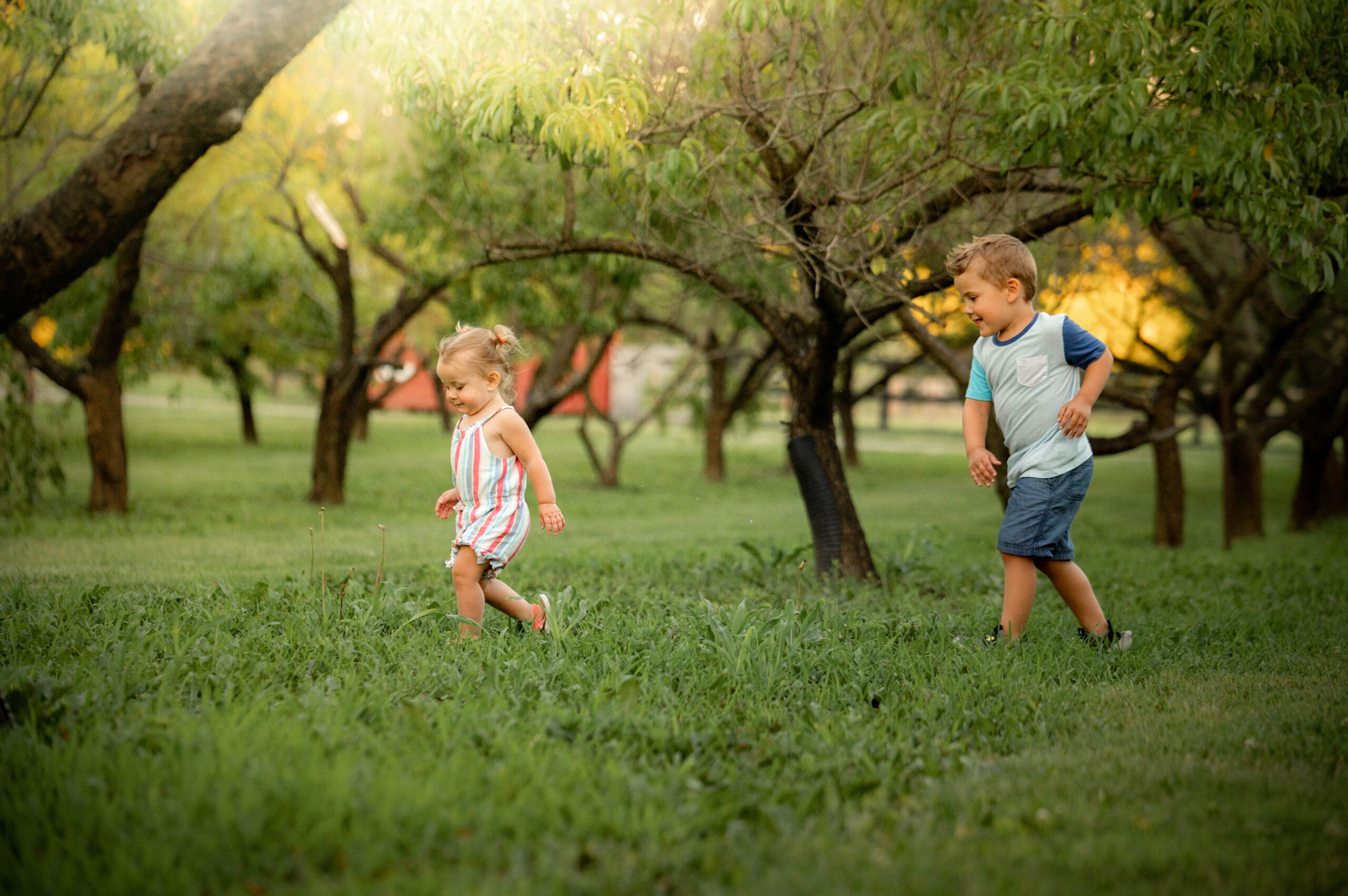 siblings chasing each other in a park Things to Do in Dayton With Kids