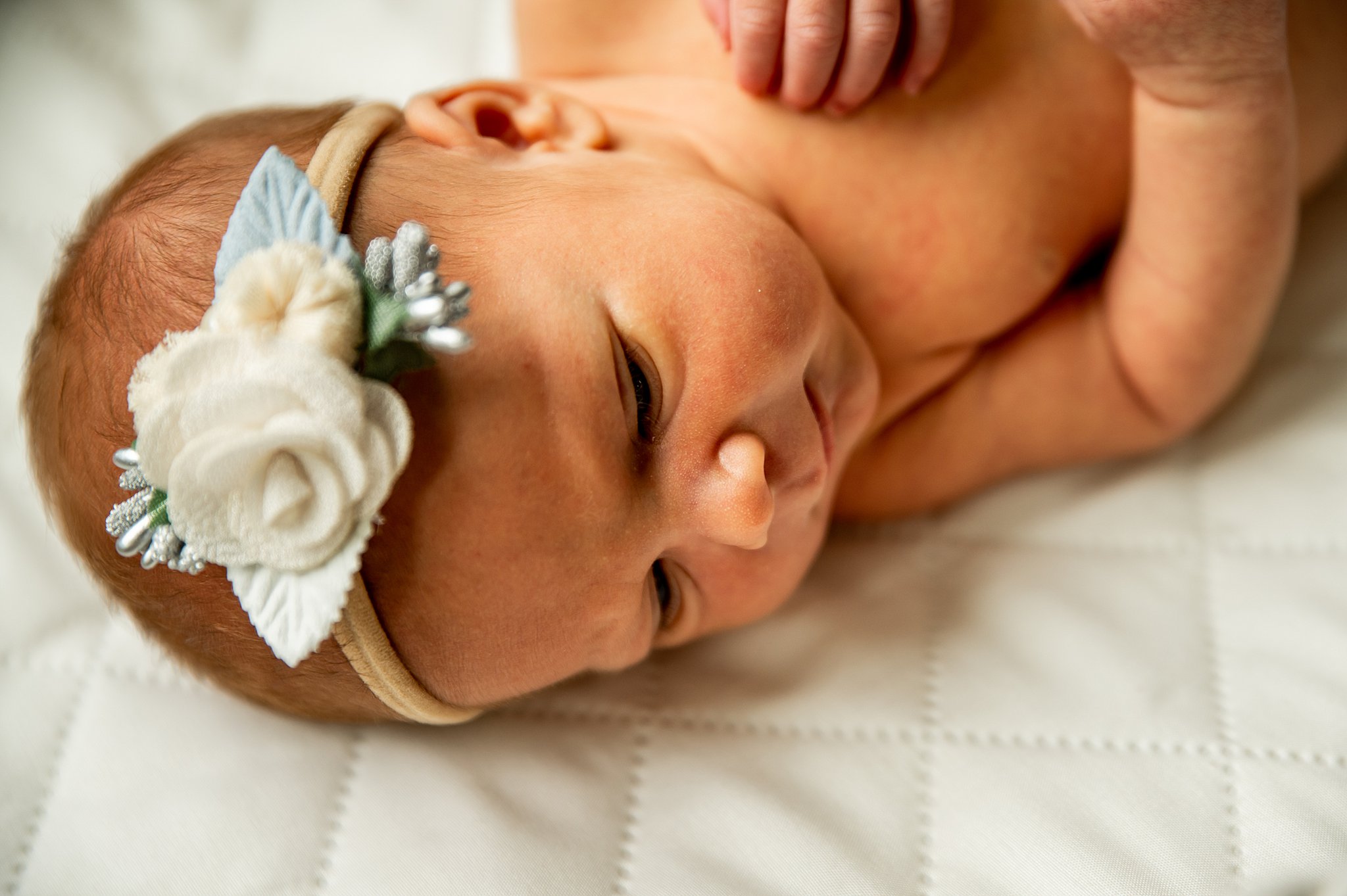 newborn baby girl with a flower headband Birthing Center Dayton Ohio-Dayton-Ohio