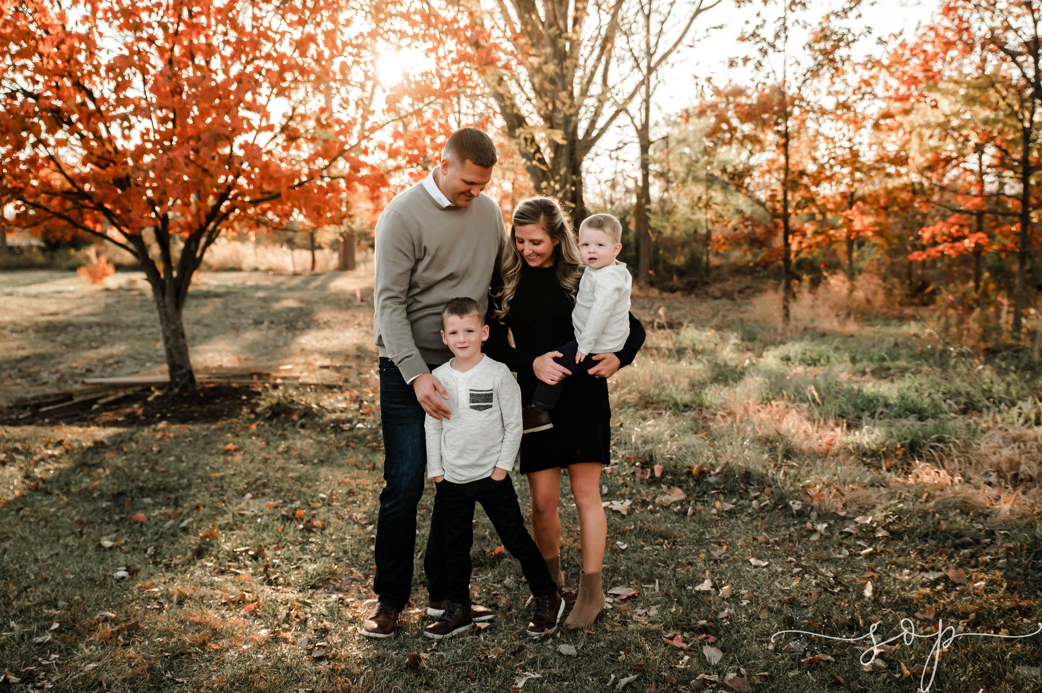 family photo in leaves in the fall